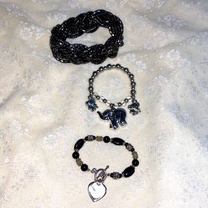 Bundle of three bracelets silver toned